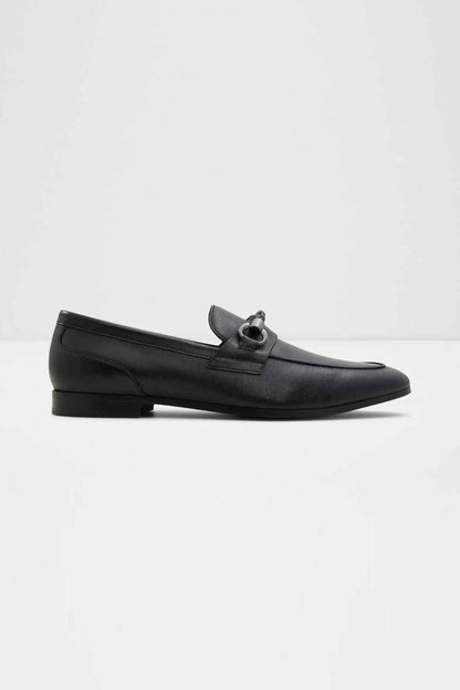 Black leather loafer with metal bit hardware and low heel