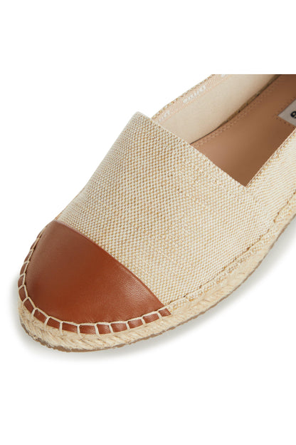 Natural woven espadrille with tan leather side panel and stitched jute sole