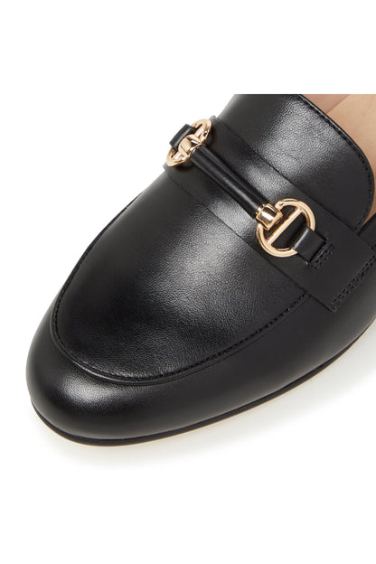 Close-up black leather loafer with gold-tone buckle ornament