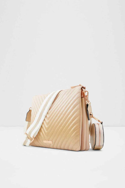 Chevron quilted beige crossbody bag with adjustable white strap and matching pouches