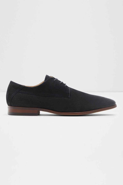 Black lace-up oxford shoes with brown low heel and cap toe detail