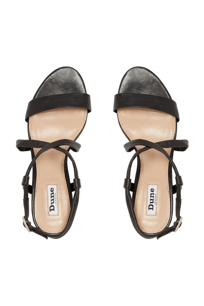 Pair of black heeled sandals with ankle straps and cross straps, open toe