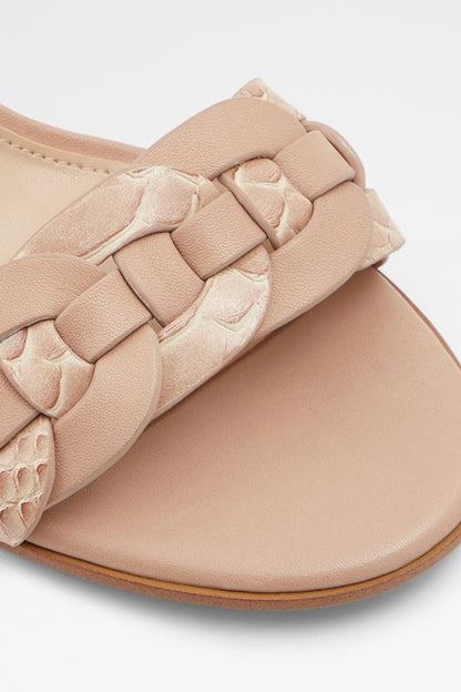 Bone leather heeled sandal close-up of braided toe strap and textured finish