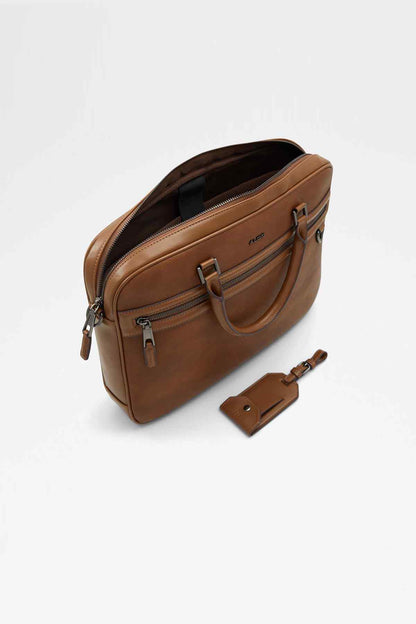 ALDO brown leather satchel side detail with adjustable strap and key tag