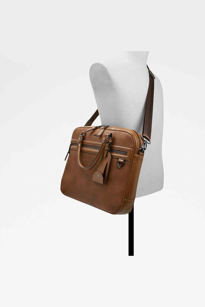ALDO brown leather satchel on mannequin with long crossbody strap and front flap