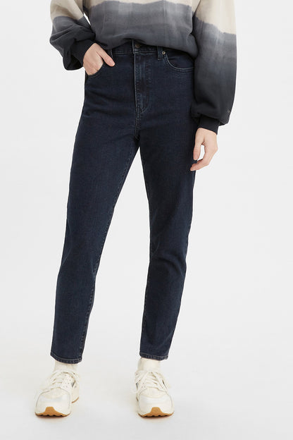 Levi's dark blue denim jeans with straight legs and cuffed hem, front view