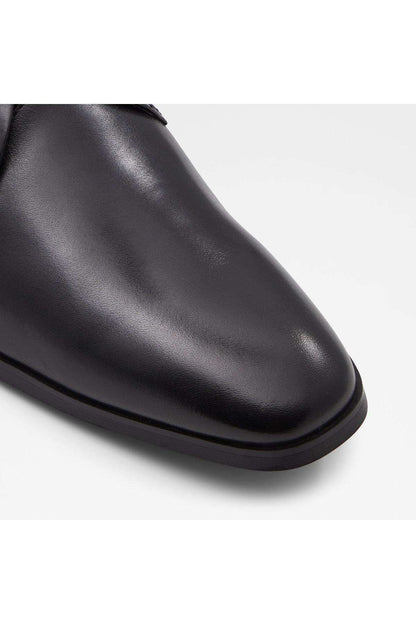 Black leather oxford shoe toe and upper, smooth finish, lace eyelets