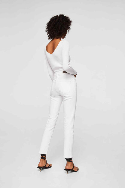 White long-sleeve knit top and high-rise white jeans, back view, belt loops