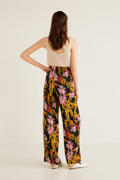 Back view: sleeveless mesh camisole with high-waist floral wide-leg trousers