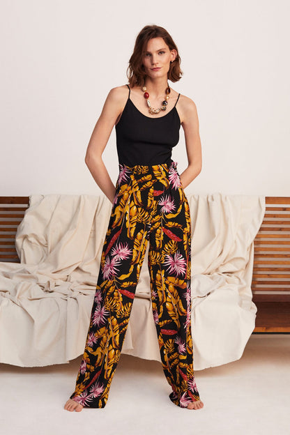Sleeveless black camisole with high-waist tropical floral wide-leg trousers