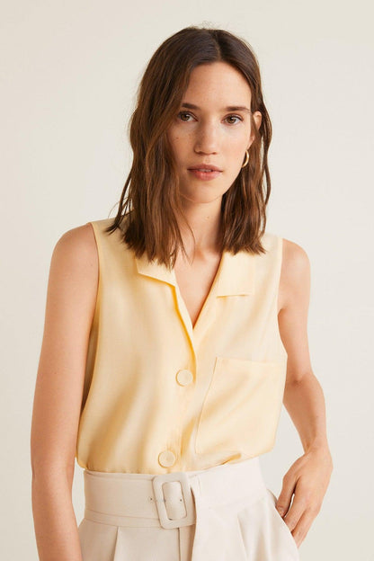 Vanilla sleeveless button-front blouse with collar and draped belt, front view