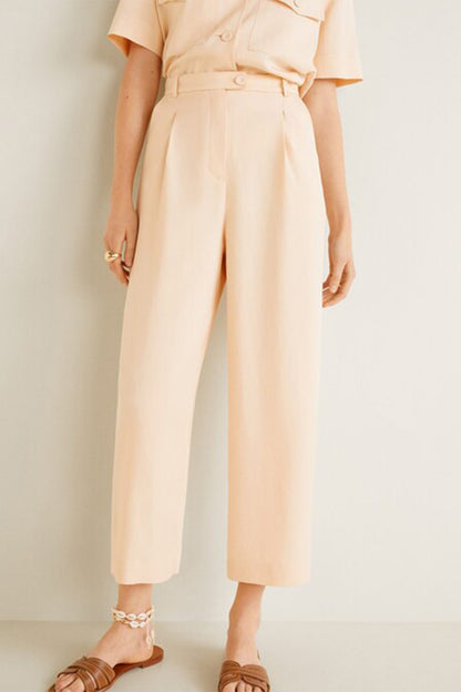 MANGO peach belted jumpsuit with short sleeves and button front, wide cropped legs