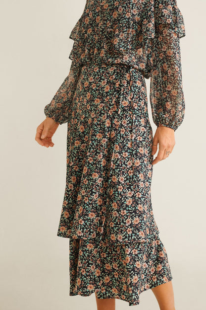 Black floral long-sleeve midi dress with tiered skirt and smocked waist