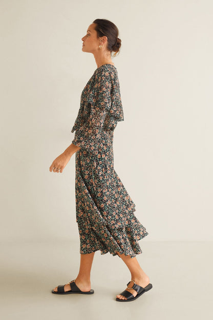 Black floral long-sleeve midi dress with layered ruffles and flowing A-line skirt