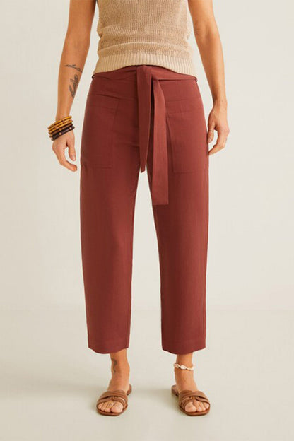 Burnt orange tie-waist tapered trousers, ankle length, front belt tie