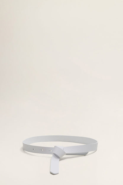 White belt with T-shaped buckle and perforation holes