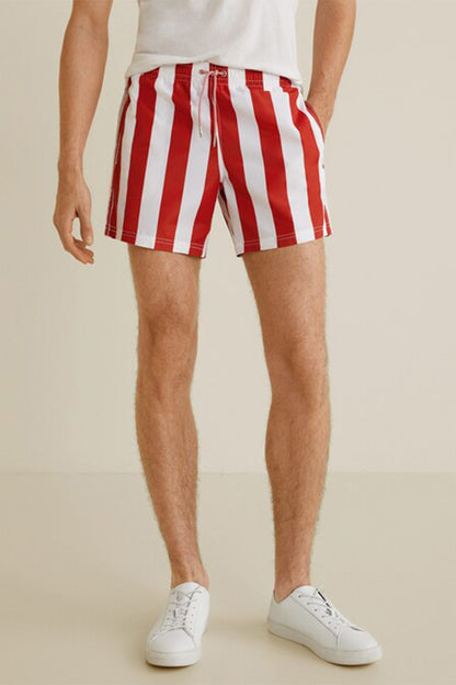 Red and white vertical striped shorts, above-knee length, elastic waistband