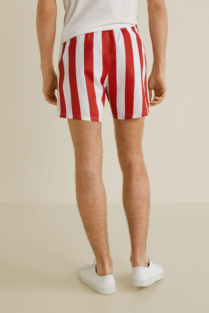 Red and white vertical striped shorts with elastic waistband, back view