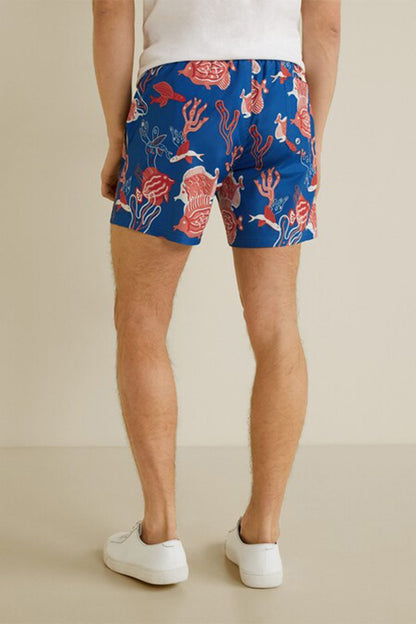 MANGO navy swim shorts with red coral pattern, straight above-knee hem