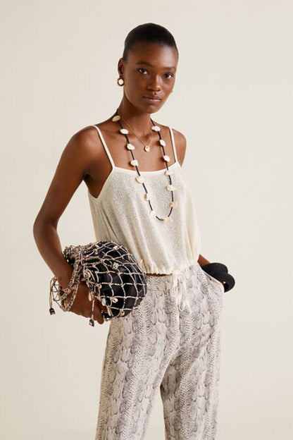 Off-white camisole top with snakeskin-print wide-leg pants, sleeveless