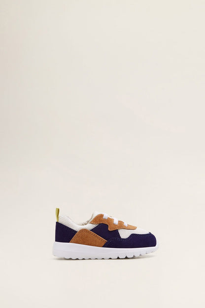 Navy, tan and white lace-up sneakers with low profile cushioned sole