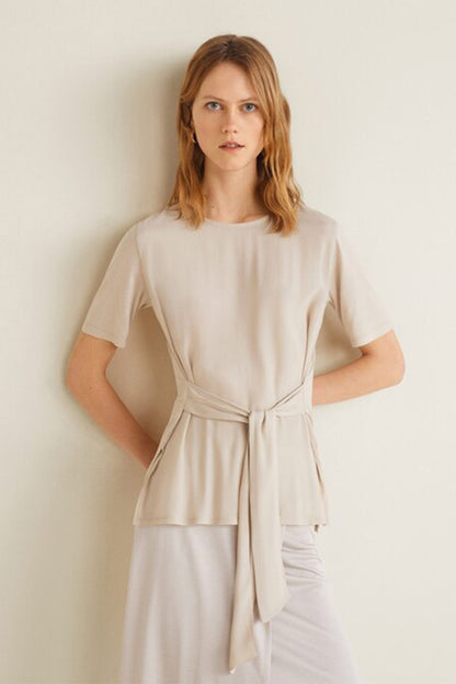 Light grey short-sleeve top with waist tie and draped peplum hem