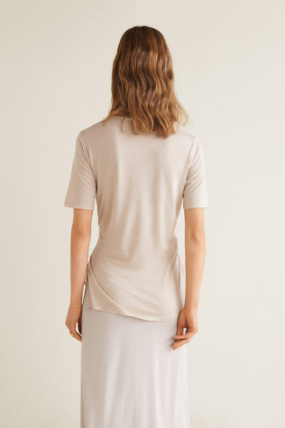 Light grey short-sleeve top with waist tie, back view