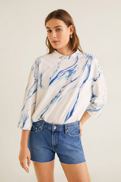 Women's white long-sleeve crewneck sweatshirt with blue abstract splash print