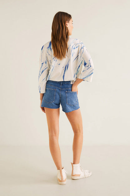 Women's white crewneck sweatshirt with blue abstract print, side/back view