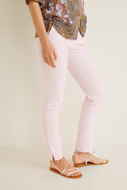 Pastel pink slim ankle pants with cuffed hems