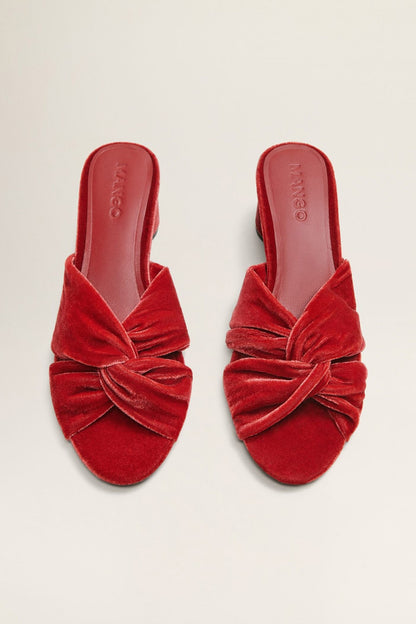 Pair of red velvet mules with twisted front knot and block heel