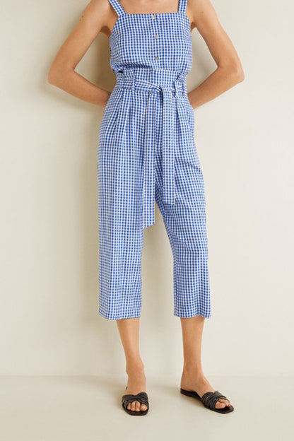 Blue gingham sleeveless jumpsuit with square neckline and tied waist
