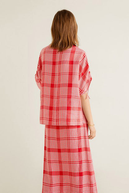 Red plaid shirt-style midi dress, back view with tied sleeves and belt