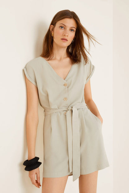 Light green belted romper, V-neck, short sleeves, button front