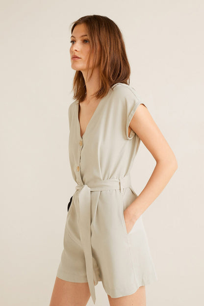 Light green belted romper with V-neck and button front, tied waist