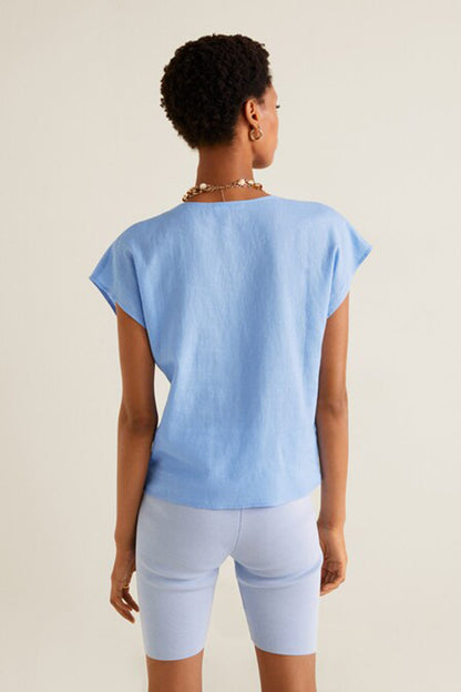 Light blue V-neck blouse with short sleeves, back view