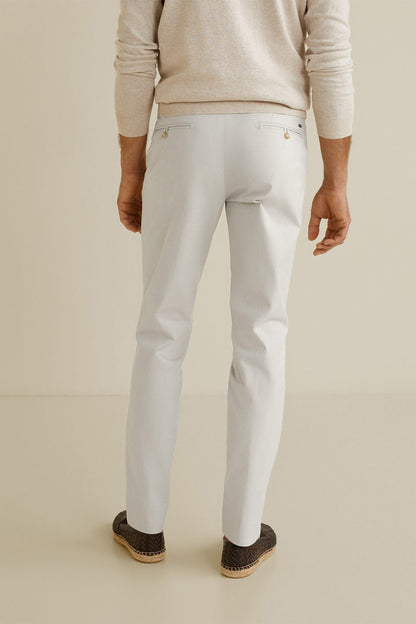 Light off-white chinos with belt loops, button fly, angled side pockets, tapered leg