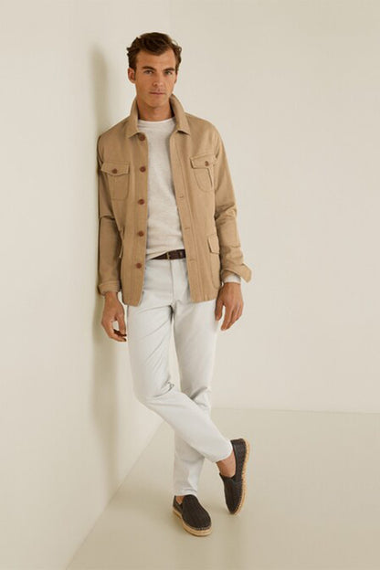 Light off-white pants with zipper fly and front pockets, tapered leg