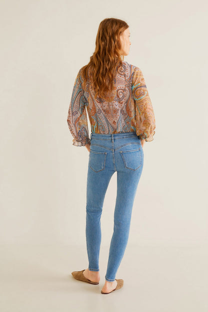 Women’s mid-blue denim skinny jeans, tapered leg with belt loops and rear pockets