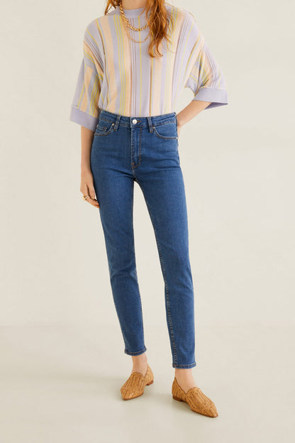 Medium-blue denim jeans, slim tapered fit, button and zip fly, front and back pockets