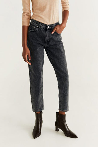 Dark denim jeans close-up, five-pocket design, button fly and stitched seams