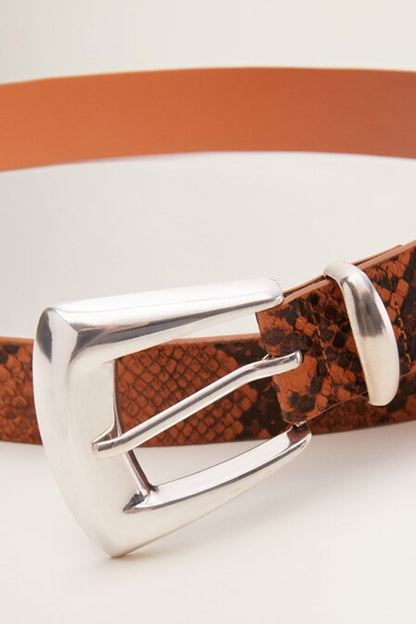 Caramel belt buckle with silver frame over textured snake-skin pattern