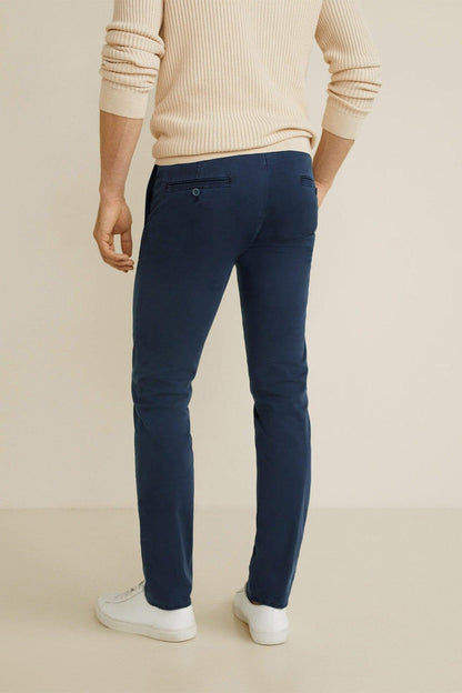 Navy slim-fit trousers with front button closure and belt loops