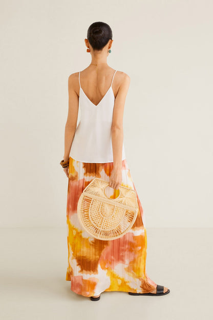 Off-white camisole top with thin straps and V-back