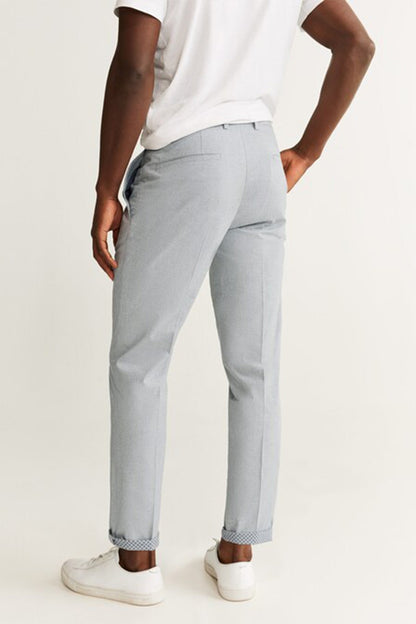 Light grey slim trousers, mid-rise, side pockets, cuffed hem