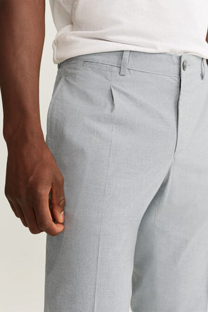 Grey trousers back yoke seam with belt loop and buttoned waistband