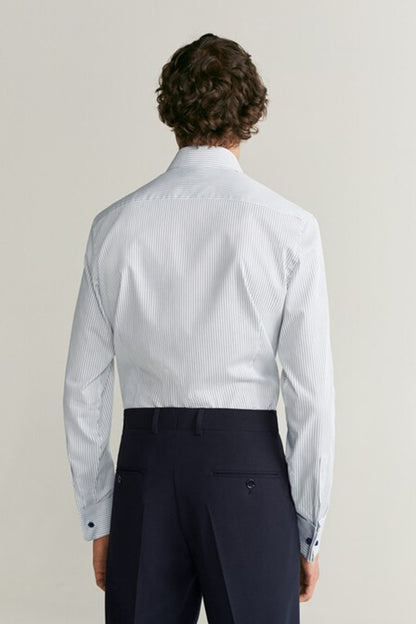 White striped dress shirt back view with button cuffs and yoke