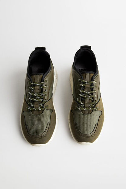 Khaki lace-up sneakers pair, textured uppers and black collars, chunky sole