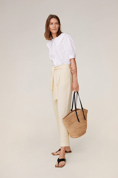 Ecru tie-waist trousers with gathered waist and relaxed straight legs