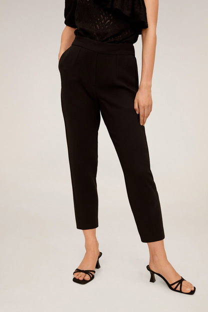 Black tailored ankle pants with waist tie, part of ruffle one-shoulder jumpsuit
